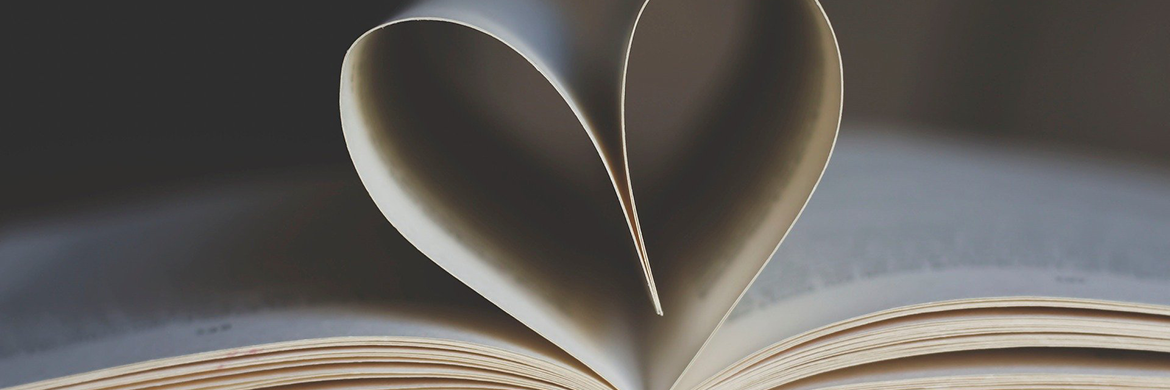 Support header showing an open book with pages curled inward to form a heart shape