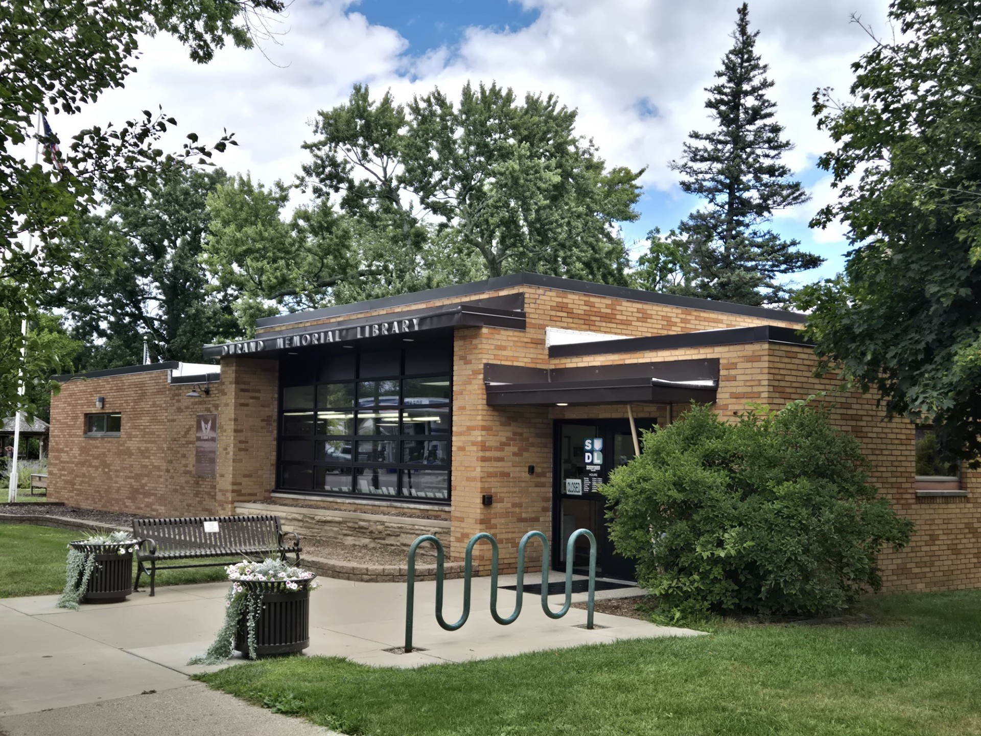 Photo of the Durand Memorial Library building during the summer