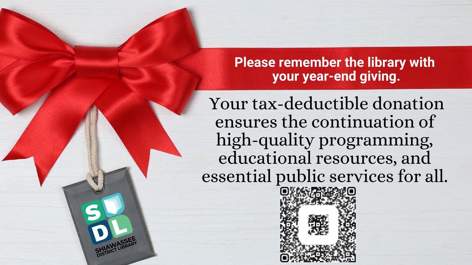 Red Holiday Bow with SDL tag hanging down next to QR code to make a donation to the library